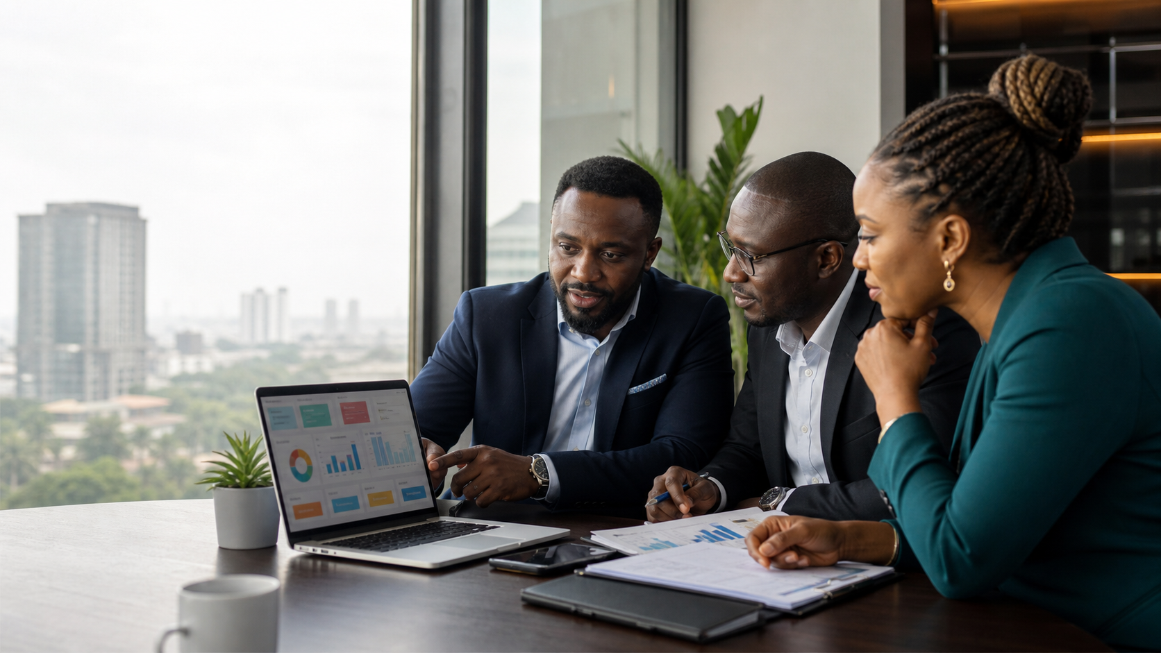 Nigerian CEO, finance lead and operations manager comparing business systems